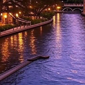 The San Antonio River Walk lit up at dusk