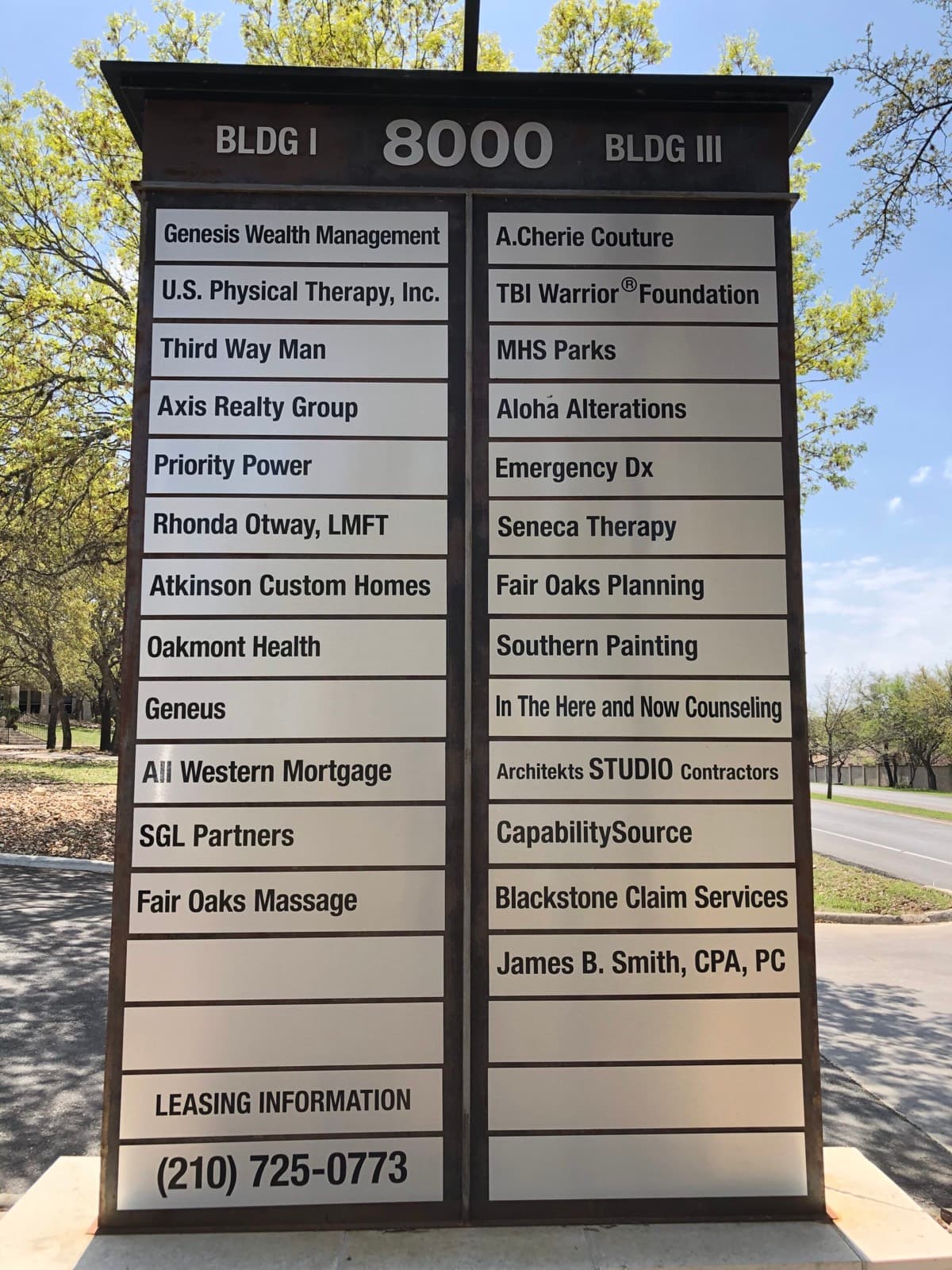 Outdoor directory sign for 8000 Fair Oaks Pkwy listing In The Here and Now Counseling among the building tenants.